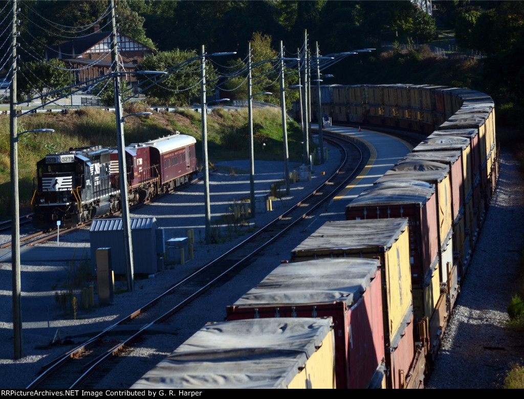 Many tarped loads on NS train 25A sweep past the NS research train